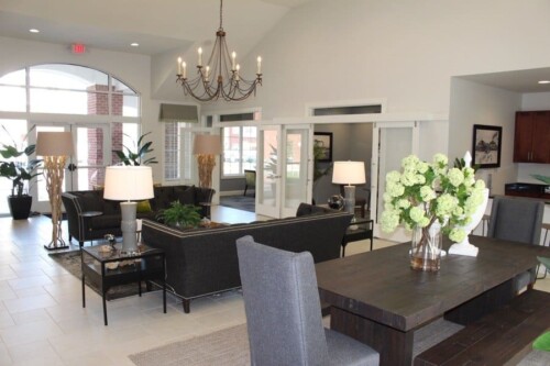 Clubhouse lounge and dining area at Clairmont at Campostella Station Apartments