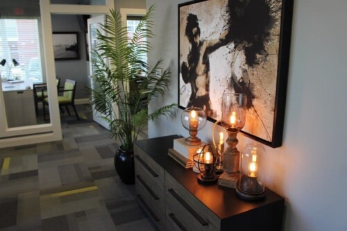 Clubhouse console table and artwork at Clairmont at Campostella Station Apartments