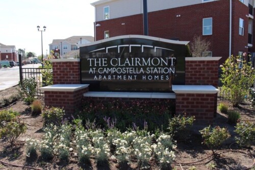 The Clairmont at Campostella Station entrance sign with landscaping