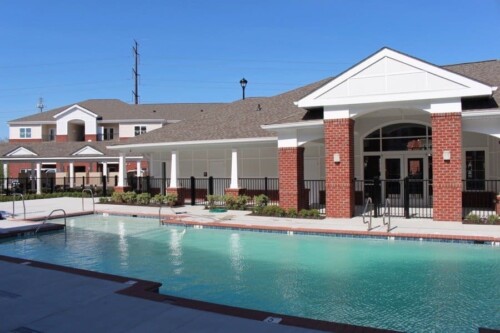 Clubhouse and resort-style pool at Clairmont at Campostella Station Apartments